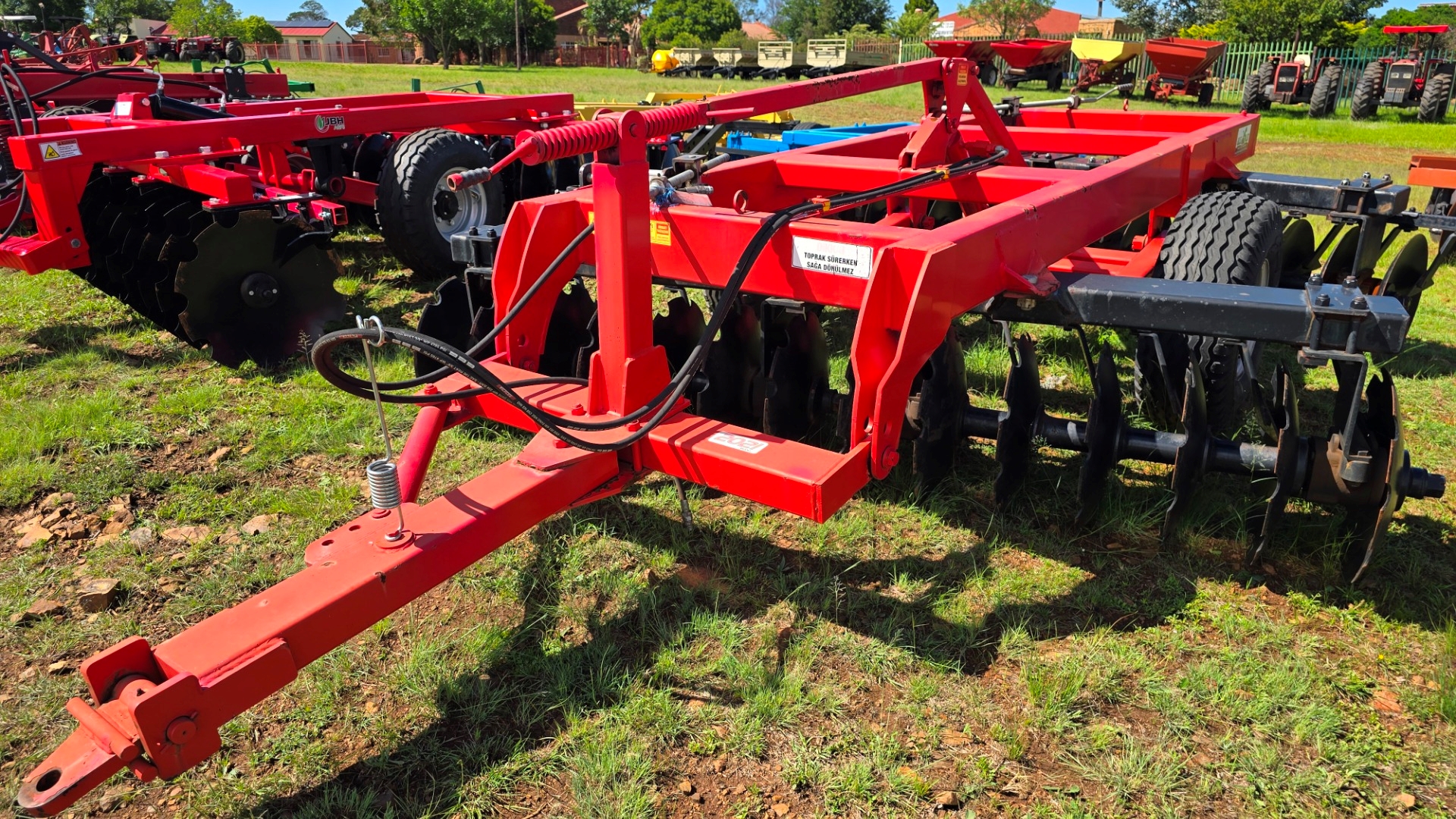 Disk harrow cultivating farm land